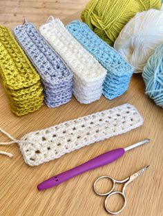 crochet supplies including yarn and scissors on a table