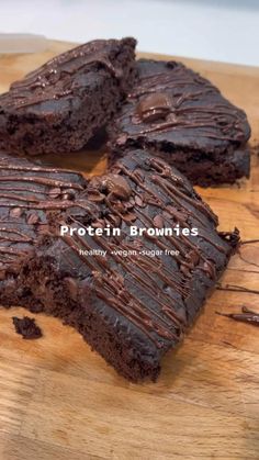 chocolate brownies on a cutting board with the words protein brownies