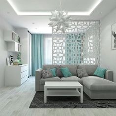 a modern living room with white walls and blue curtains on the windowsill, gray sectional sofa