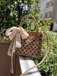 a handbag is sitting on a ledge outside