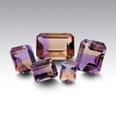 Ametrine10 x 8mm Octagon Faceted Stone    Bi-color ametrine presents is most attractive look when rough stones are carefully chosen to produce a stone that's as close as possible to half amethyst and half citrine. Rarely seen with a perfect half-and-half split, the exact proportions from stone to stone vary slightly, giving each stone a unique appearance. This ametrine gemstone coordinates well with either amethyst or citrine, as well as with complementary color stones. Color Stones, Half And Half, Amethyst Quartz, Purple Stones, Latest Jewellery, Rough Gemstone, Tourmaline Gemstone, Gems And Minerals, Jewelry Business