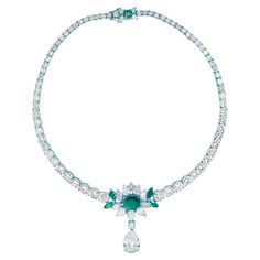 A DIAMOND AND EMERALD NECKLACE The necklace features a circular-cut diamond graduated design and is adorned with an oval-cut emerald of approximately 5 carats. A pear-shaped diamond, mounted in gold, weighing approximately 10 carats, is suspended from a diamond cluster. Teal Jewelry, Platinum Necklace, Jewellery Indian, Diamond Necklace Set, Family Jewellery, The Necklace, Italian Jewelry, Colombian Emeralds, Emerald Necklace