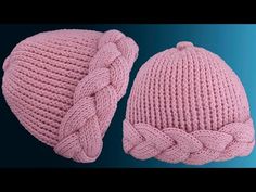 two pink knitted hats with braids on them