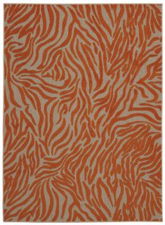 an orange and white rug with zebra print