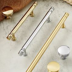 brass handles and knobs on a marble countertop