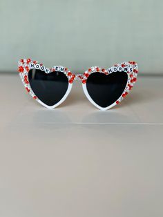 Bedazzled retro heart sunglasses perfect for any University of Texas fan.  Use these sunglasses to complete your Game Day outfit or gift to any UT Longhorn, Hook 'Em! Please note this is a made to order item and no two sunglasses will be the same.  Exact color and placement of gems will have slight variation. Ensuring your purchases arrive in perfect condition is important to me! Sunglasses are packaged in hard, sturdy boxes with crinkle cut packing paper. All sunnies are shipped with a squeeze Valentine's Day Gift Sunglasses With Tinted Lenses, Heart-shaped Glass Sunglasses For Gift, Heart-shaped Glass Sunglasses As Gift, Heart-shaped Sunglasses For Valentine's Day Gift, Ut Longhorns, Retro Heart, Texas Gifts, Packing Paper, Rhinestone Sunglasses