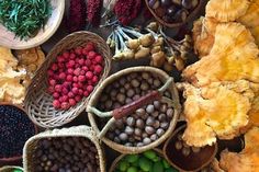 many baskets filled with different types of fruits and vegetables