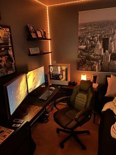 a bedroom with two computer monitors and a chair in front of the monitor on the desk