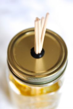 a jar with some sticks sticking out of it