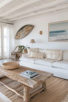 a living room filled with furniture and a surfboard mounted to the wall above it