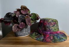 This pretty, reversible bucket/sun hat can be worn on both sides since it features two patterns,(as shown in photos) basically two hats in one.  Pick a mood and you got a hat. Makes a nice gift for someone who spends lots of time outdoors.  Hat inside circumference measures 22" and will fit most adults. Bucket Hats, Sun Hat, Sun Hats, Denver, Caps Hats, Bucket Hat, Accessories Hats, Best Gifts, Accessory Gift