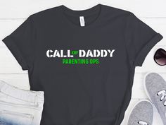 Description: Call of daddy parenting ops shirt, Dad tshirt, Gift for dad shirt, Funny daddy shirts, family tees, daddy tee, gift for hubby, Call of daddy Materials: Ringspun cotton, soft cotton, cotton,  HOW TO ORDER  1-) Check and Review all Photos. 2-) Select Your T-Shirt Size and T-Shirt Color from drop down menus. 3-) Select Your Design Print Color from images. 4-) Choose Quantity. 5-) Click ADD TO CART. You can go back and add a different color for your family members or you can complete th Father's Day Family Matching T-shirt With Funny Print, Black T-shirt For Father's Day, Black Unisex T-shirt For Father's Day, Black T-shirt For Father's Day Parenting, Father's Day Black T-shirt With Funny Print, Fun Custom Print T-shirt For Father's Day, Dad Tshirt, Gifts For Hubby, Papa T Shirt