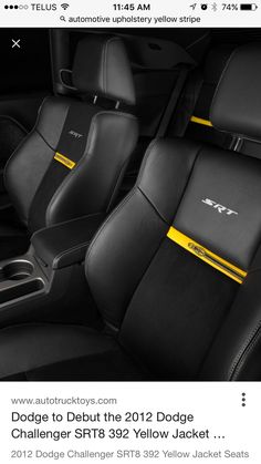 the interior of a car with black leather seats and yellow trimmings on it