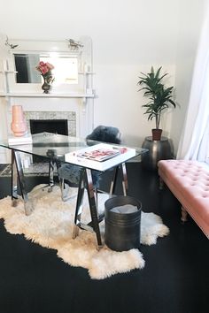 a living room filled with furniture and a fire place