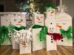 snowmen are wrapped in green and white paper