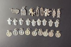 26 pieces of antique silver tone charms.  Lead and Nickel Free Zinc Alloy. These charms are perfect for making jewelry (earrings, bracelets, bookmarks, keychains, purse dangles).   Let your creativity flow! Charm Reading, Purse Dangles, Charms For Jewelry Making, Making Jewelry, Silver Charms, Zinc Alloy, Antique Silver, Silver Tone, Charms