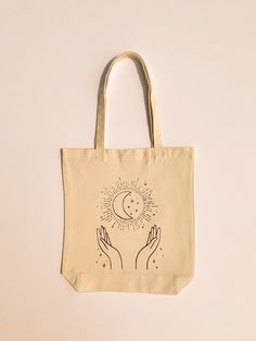 -Hand printed -Can hold up to 30 pounds -Machine washable, air dry -Eco-friendly way to bring around your favorite items! Perfect for grocery shopping, retail shopping, farmers markets, using as a purse, book bag, or beach bag. Eco-friendly Ink Canvas Tote Bag For Travel, Reusable Canvas Travel Bags, Reusable Canvas Tote Bag For Travel, Reusable Tote Canvas Bag For Travel, Rectangular Reusable Canvas Travel Bag, Reusable Rectangular Canvas Travel Bag, Beige Reusable Bags For Daily Use, Eco-friendly Ink Tote Bags For Everyday Use, Eco-friendly Softback Bag For Daily Use