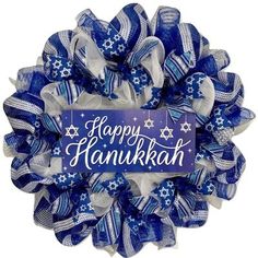 a blue and white wreath with happy hanukkah written on it