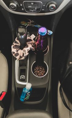 the interior of a car with an animal print bow tie and other items in it