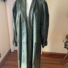 Vintage Full Length Soft Leather Coat Fully Lined With Two Pockets. Shiny, Looks Like A Snakeskin, Color Curry Leaves/ Dark Green. Absolutely Gorgeous Piece!!! This Is A Unique Item Will Bring Everyone Eyes On It! Measurements Pit To Pit 28” Sleeves Shoulders To Hem 32” Length 52" Chic Long Green Outerwear, Fitted Long Green Outerwear, Fitted Olive Long Sleeve Outerwear, Olive Fitted Long Sleeve Outerwear, Elegant Long Khaki Outerwear, Fitted Olive Outerwear, Chic Fitted Olive Outerwear, Elegant Oversized Green Outerwear, Elegant Green Oversized Outerwear