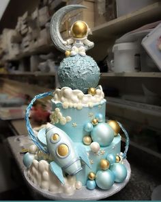 a blue and white cake with gold accents