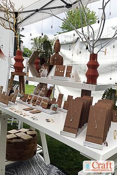 a table with many items on it under a tent