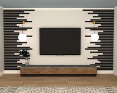 a tv mounted on the wall in a living room with black and white striped walls