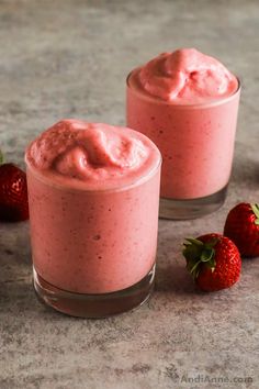 two small glasses filled with strawberry cheesecake pudding