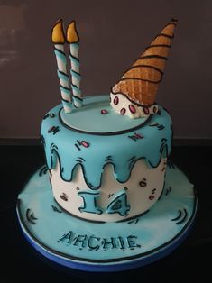 a birthday cake with an ice cream cone on top