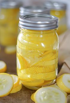 a jar filled with pickles sitting on top of a table