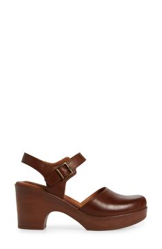 A woodgrain platform heel on a clog-inspired pump brings retro style to your ensembles. 3" heel Round toe Adjustable slingback strap with buckle closure Cushioned footbed Synthetic upper and lining, rubber sole Imported Brown High Heel Slingback Pumps With Buckle, Brown Wedge Heel Clogs With Buckle Closure, Brown Slingback Pumps With Stacked Heel And Ankle Strap, Brown Leather Clogs With 4-inch Heel, Brown High Heel Slingback Pumps With Buckle Closure, Brown Ankle Strap Platform Clogs, Brown Slingback Pumps With Ankle Strap And Platform, Brown Wedge Heel Clogs With Heel Strap, Brown Platform Slingback Pumps With Ankle Strap