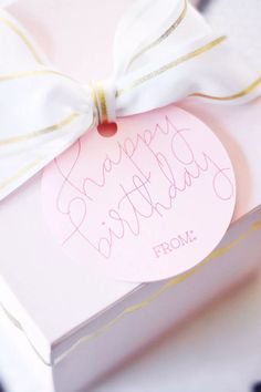 a pink birthday card in a box with a white bow on it that says happy birthday from mom