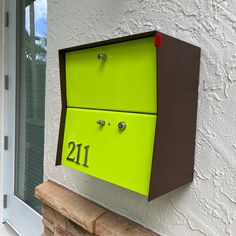 -The RetroBox Locking Small Package Wall Mounted Mailbox is a Mid-century modern inspired locking mailbox, the perfect curb appeal for your home, office, condo or development. Made of quality materials, here in the USA. -RetroBox Locking Wall Mounted mailbox. Large enough to hold days of mail and locking to keep your mail secure. -The RetroBox Small Package Wall Mounted Mailbox in Coco Nut is available in 15 different door finishes, can be ordered with stainless steel numbers in your choice of n Door Finishes, Wall Mount Mailbox, Mounted Mailbox, Black Retro, Mailbox, Jet Black, Curb Appeal, Century Modern, Wall Mount