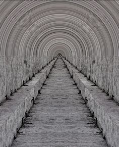 an image of a very long tunnel that looks like it is going down the hill