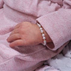 This keepsake bracelet is made with genuine soft white freshwater pearls and 14K Gold-plated beads! This is a high quality bracelet in sterling silver with 14K gold plating. Each bracelet has an extension chain, so as the child grows you just move to the next link for a perfect fit. This bracelet is available in three sizes and is great for infants, babies, toddlers, and kids. This bracelet comes in a beautiful gift box. Hand made in the USA! Make it extra special by adding engraving so it's spe Classic Personalized White Pearl Bracelet, Hypoallergenic Pearl Bracelet For Mother's Day, Classic White Pearl Bracelet For Mother's Day, Adjustable Hypoallergenic Pearl White Pearl Bracelet, Classic White Bracelets For Mother's Day, Adjustable White Pearl Bracelet For Birthday, Hypoallergenic Adjustable Pearl Bracelet For Birthday, Adjustable Hypoallergenic Pearl Bracelet For Birthday, Adjustable Hypoallergenic White Pearl Bracelet