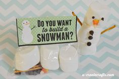 marshmallows are wrapped in cellophane to look like snowmen with a sign that says do you want to build a snowman?