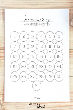 the printable calendar for january is shown on top of a piece of paper with scissors