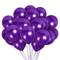 a bunch of purple balloons floating on top of each other in the shape of a heart