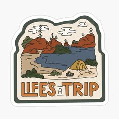 a sticker with the words, life's a trip in front of a lake and