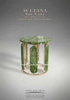 the front cover of an article about suttana side table with green glass and gold bases