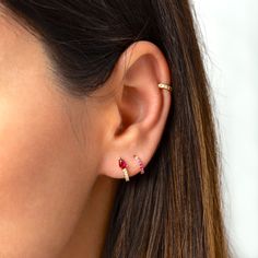 "Tiny yet stunning, these little sterling silver huggie hoops feature a pear-shaped zirconia stone that is prong-set to allow light to shine through for maximum sparkle. A versatile and classic pair that will look beautiful layered with other hoops, but are also perfect worn alone for a more minimal look. * D E T A I L S * ∙ Sold as a PAIR ∙ Material: .925 Sterling Silver or 18K Gold Plated over .925 Sterling Silver ∙ Stone: Ruby Pink or Emerald Green cubic zirconia ∙ Dimensions: Inner Diameter: Pink Hoop Earrings, Earrings Small Hoop, Nose Piercing Jewelry, Dainty Hoop Earrings, Earrings Emerald, Tiny Hoop Earrings, Mini Hoop Earrings, Small Hoop Earrings, Minimal Look