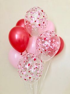 pink and red balloons with hearts on them