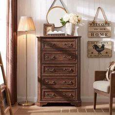 a bedroom with a dresser and chair in it