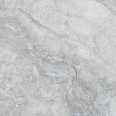 a close up view of a marble textured surface with grey and white colors,