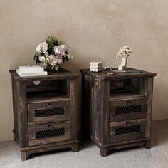 two wooden nightstands side by side with flowers on top