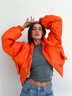 "Step into cold weather with an oversized orange women bomber jacket. Long sleeves and water repellent fabric finish - which encourages water to bead off its surface.  Plush poly fill adds extra warmth - 100% Recycled Polyester. Suitable for temperatures +10 С/-1 C ( 50.℉/30.20℉) More jackets here: https://www.etsy.com/shop/ArtVyshyvankaUA?ref=seller-platform-mcnav&section_id=39368873 🔷Model is 168cm/5'6\" and wearing size S. --------------------------------------------------------------------- Cheap Trendy Pink Windbreaker, Cheap Orange Winter Outerwear, Luxury Orange Outerwear For Spring, Cheap Fall Sports Windbreaker, Luxury Orange Outerwear For Outdoor, Cheap Nylon Windbreaker For Fall, Cheap Orange Outerwear With Buttons, Affordable Trendy Orange Outerwear, Cheap Orange Summer Outerwear