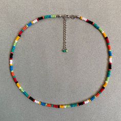 Rainbow Seed Bead Necklace -2mm Round Seed Beads - Stainless Steel Clasp - 14'' with a 2'' extended chain. (Necklace length can be customized.) 🎁 Your product will come with great care with our free gift boxes. ► INFORMATION :  💎 Please note that slight color variations may occur due to the settings of your monitor. 📨 Please feel free to message us with any questions or concerns. We are more than happy to assist you in the best way possible!   ►  PROCESSING AND SHIPPING: ✅   Processing time i Cheap Rainbow Necklaces With Colorful Beads, Multicolor Letter Beads Jewelry, Multicolor Letter Beaded Jewelry, Rainbow Round Beaded Necklaces With Tiny Beads, Multicolor Letter Beads For Jewelry Making, Colorful Adjustable Beaded Necklaces With Polished Beads, Colorful Adjustable Beaded Necklace With Polished Beads, Rainbow Spacer Beads, Colorful Letter Beads For Jewelry Making