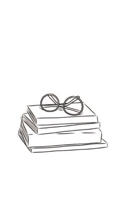 a stack of books with glasses on top