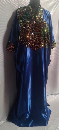 Stylish handmade kaftan made with satin material  Floor length (62 inches) One size fits all (up to size 24) Comes with a matching scarf Pocket on both sides of the kaftan Sequin material for the upper part of the kaftan blue colour Festive Blue Silk Kaftan, Festive Blue Sequined Kaftan, Blue Sequined Party Kaftan, Blue Silk Embroidered Kaftan, Blue Silk V-neck Kaftan, Satin Material, Women Long Dresses, African Women, One Size Fits All