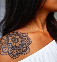 a woman's shoulder with a tattoo on it that says lykius above the neck